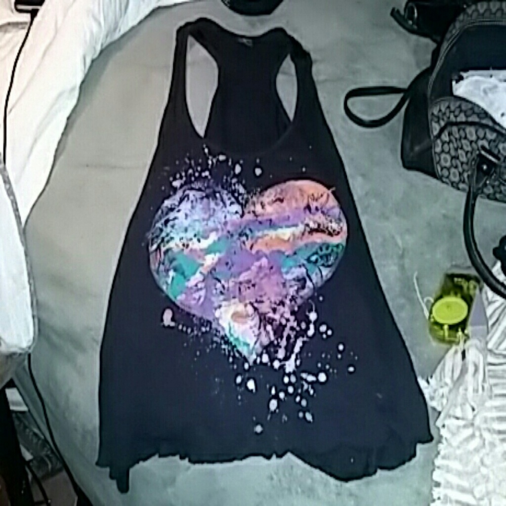 A black tank top with a heart silk screen on the f